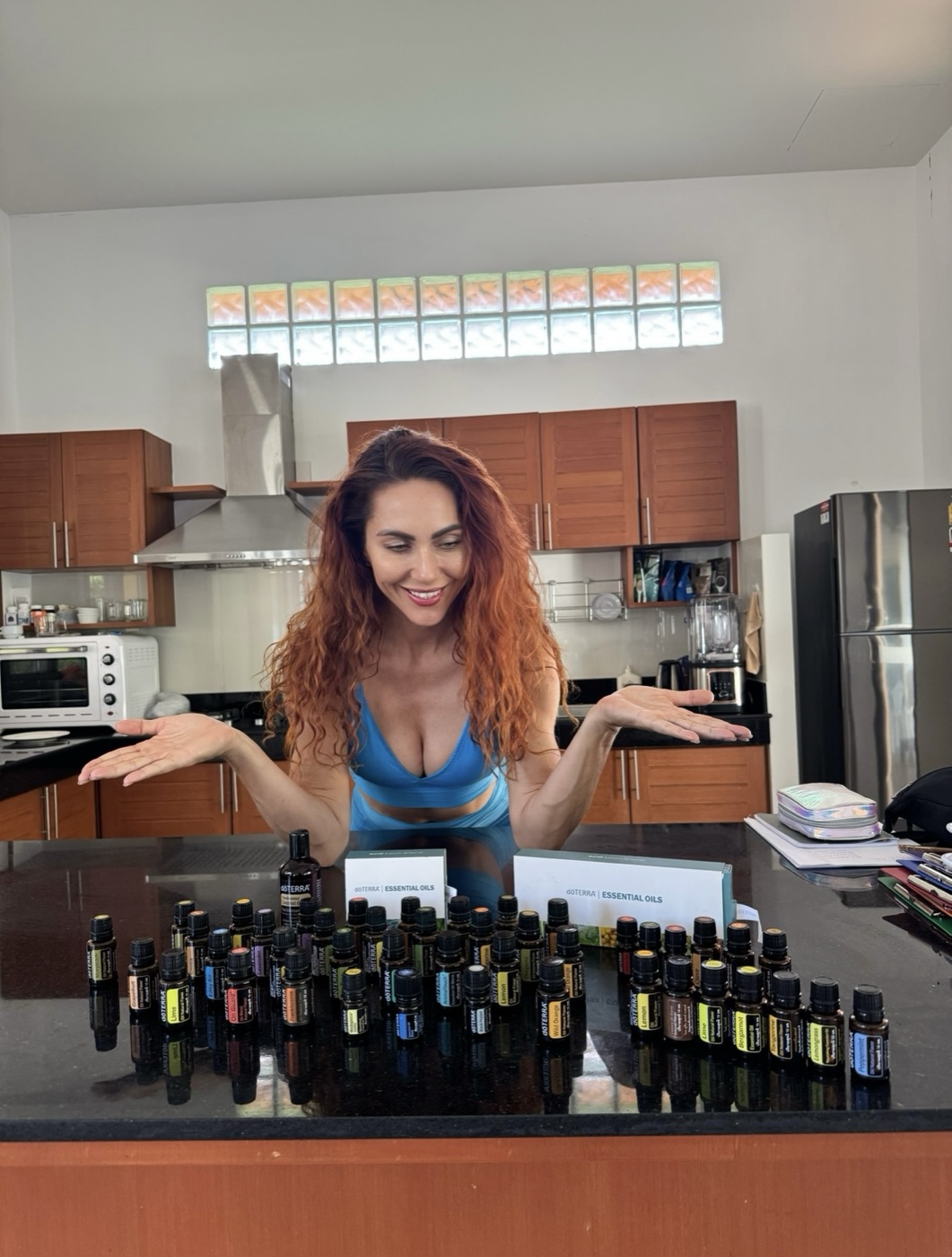 Aniko with her full doTERRA essential oil collection in her kitchen