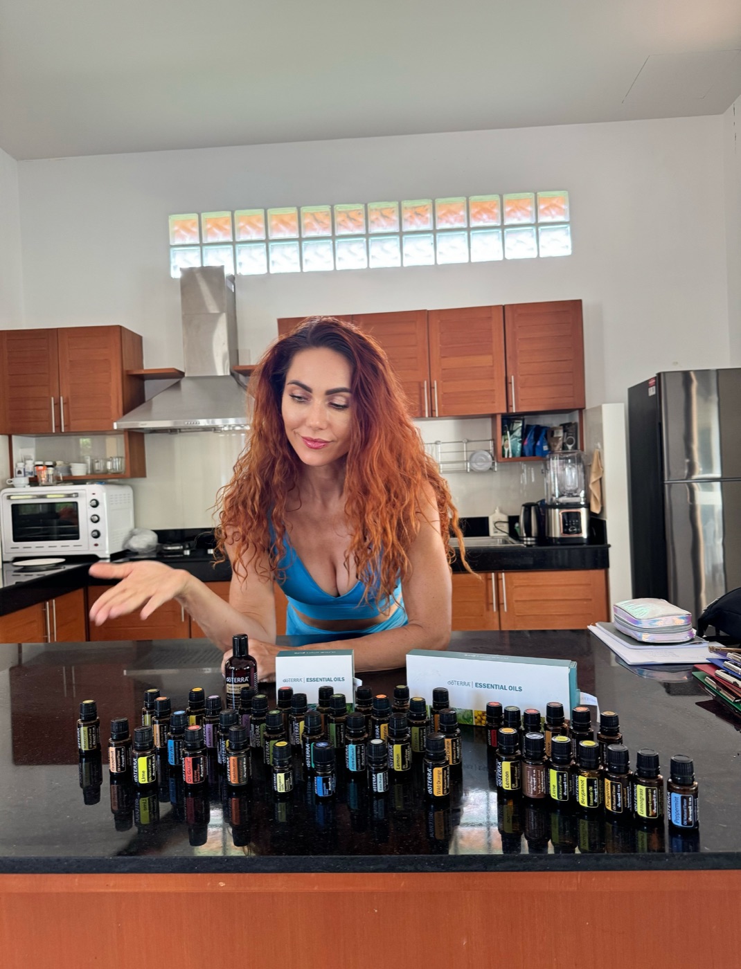 Aniko presenting doTERRA essential oils on her kitchen counter